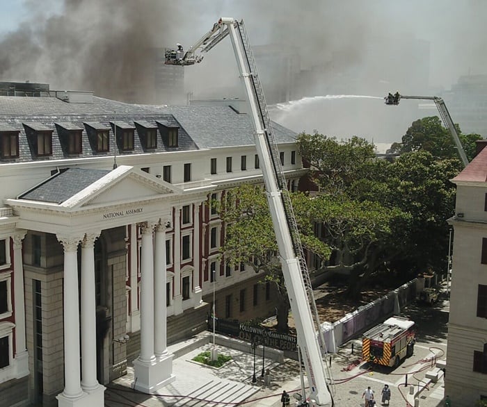 Nine suspended over fire at parliament